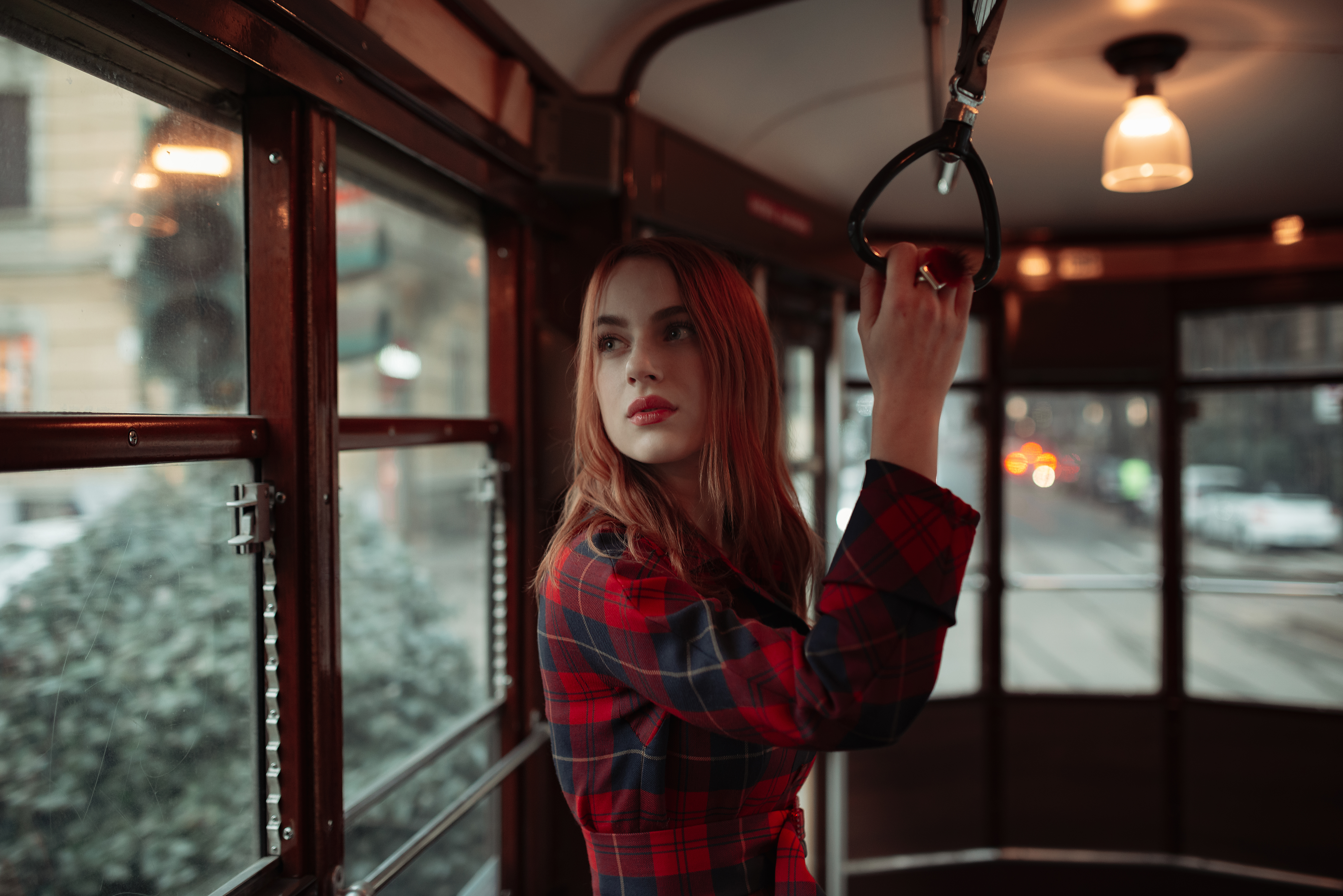 girl standing in tram 1575665240