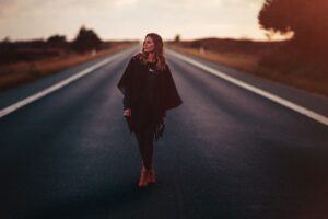 girl standing on road 1575664968