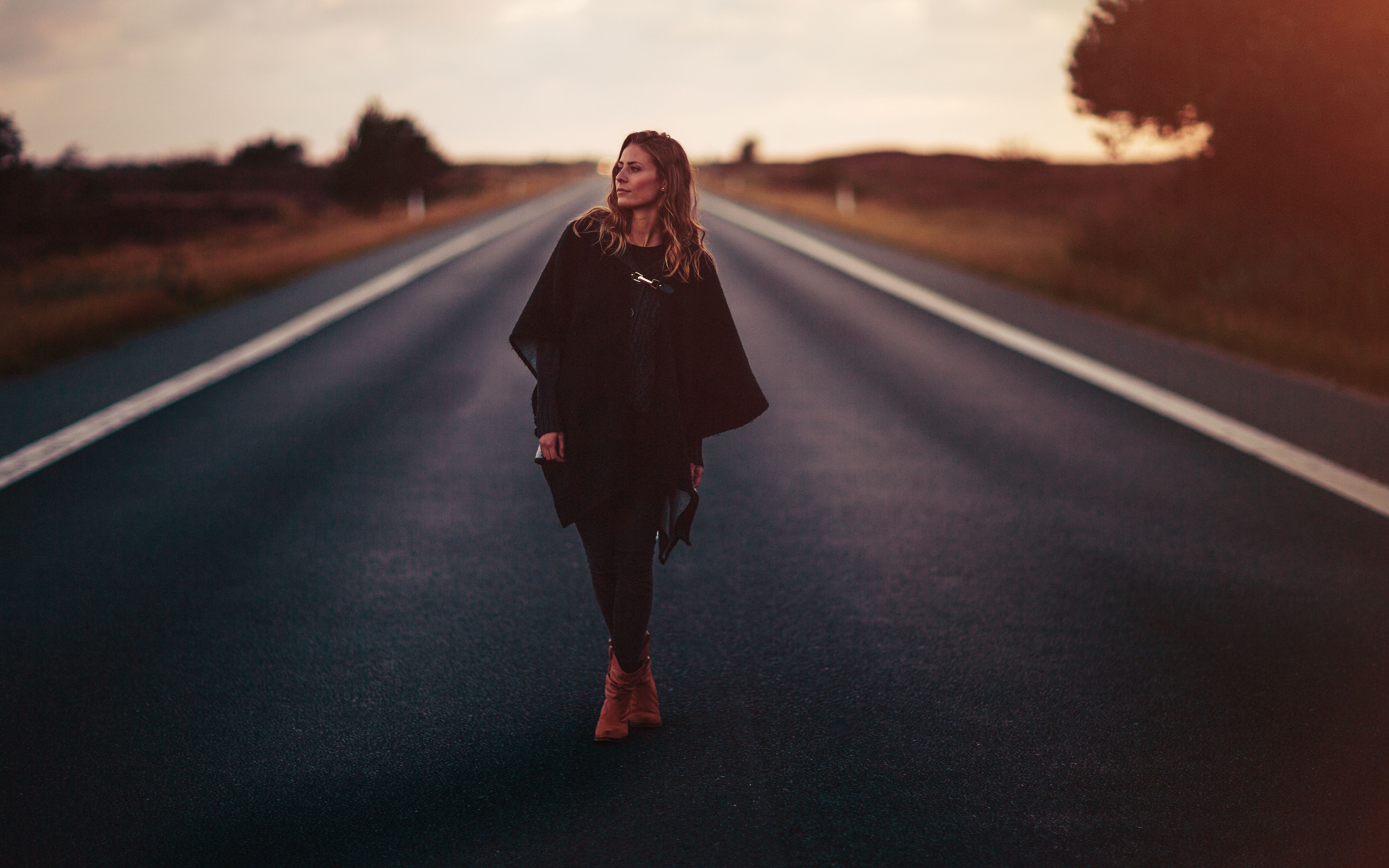 girl standing on road 1575664968