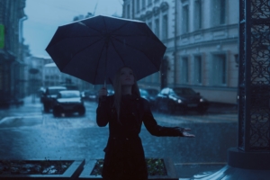 girl with umbrella enjoying rain 1575664029