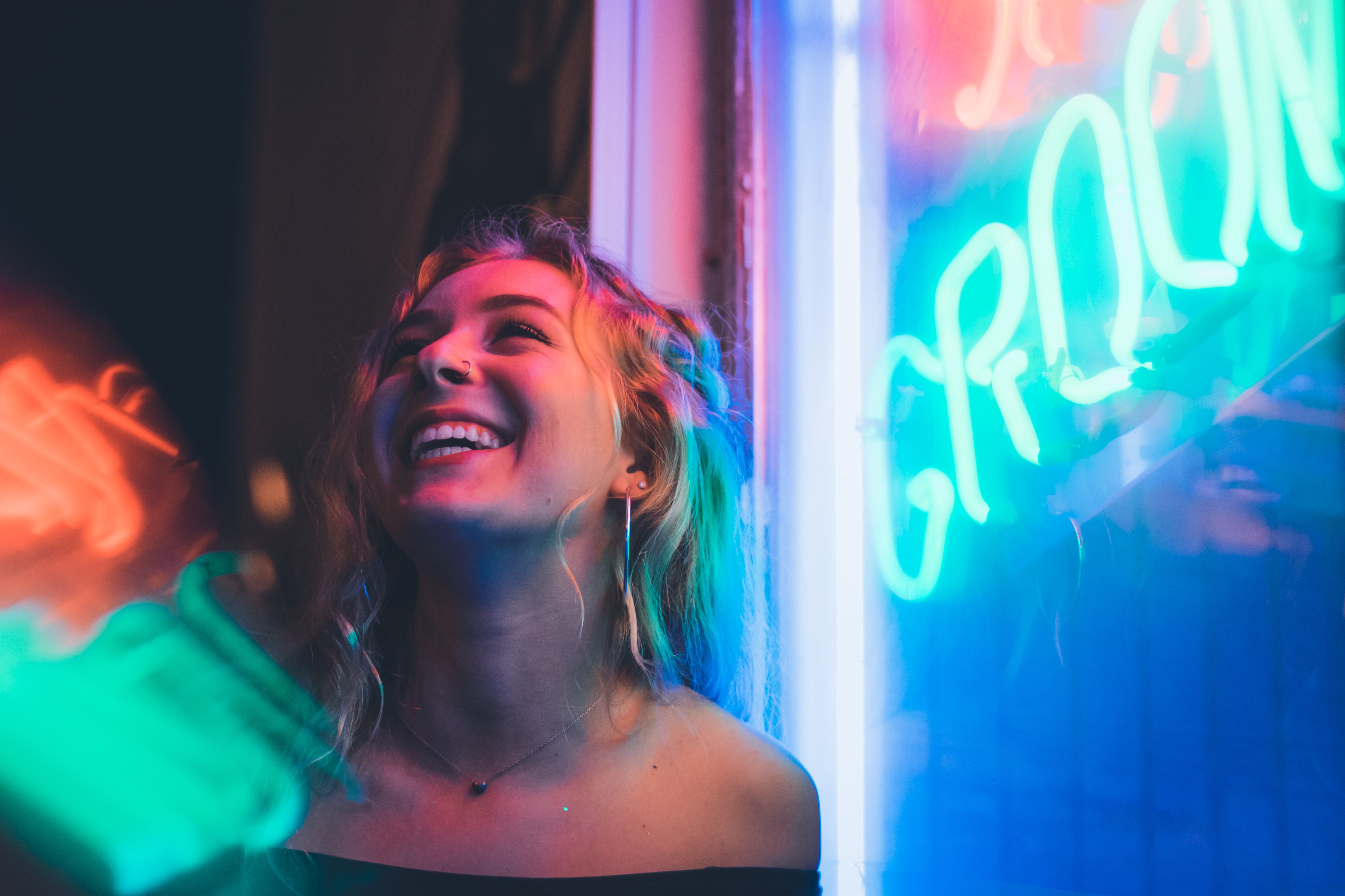 woman smiling near glass window 1575665252