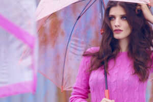 women pink sweater with umbrella 1575666048