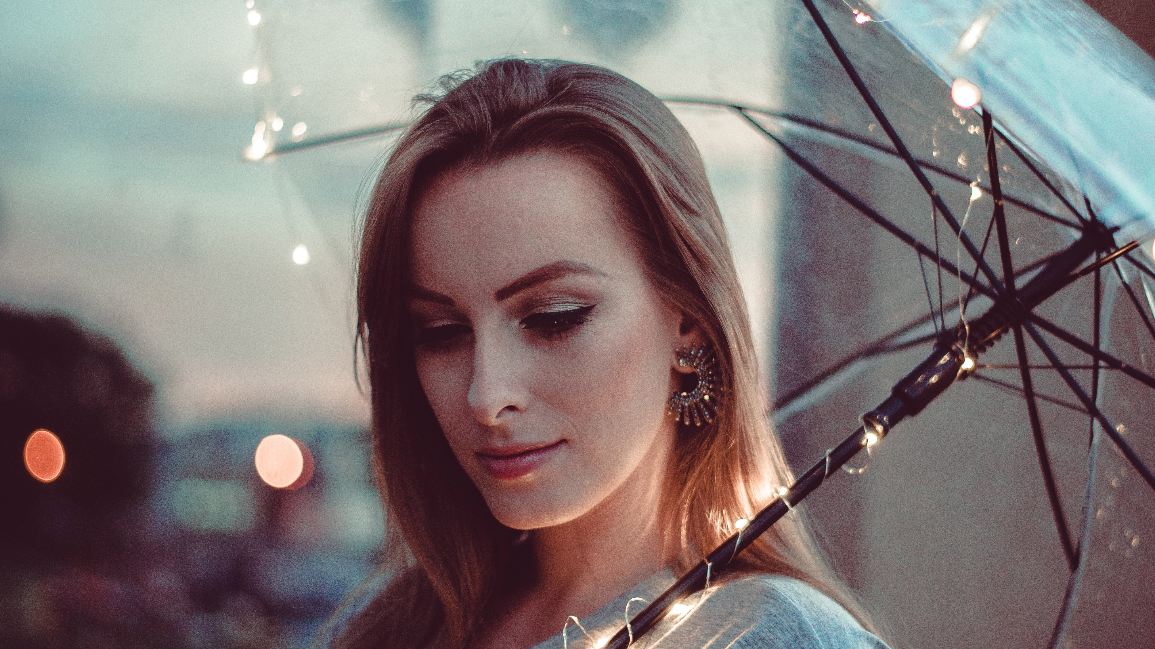 women with umbrella lights 1575665974