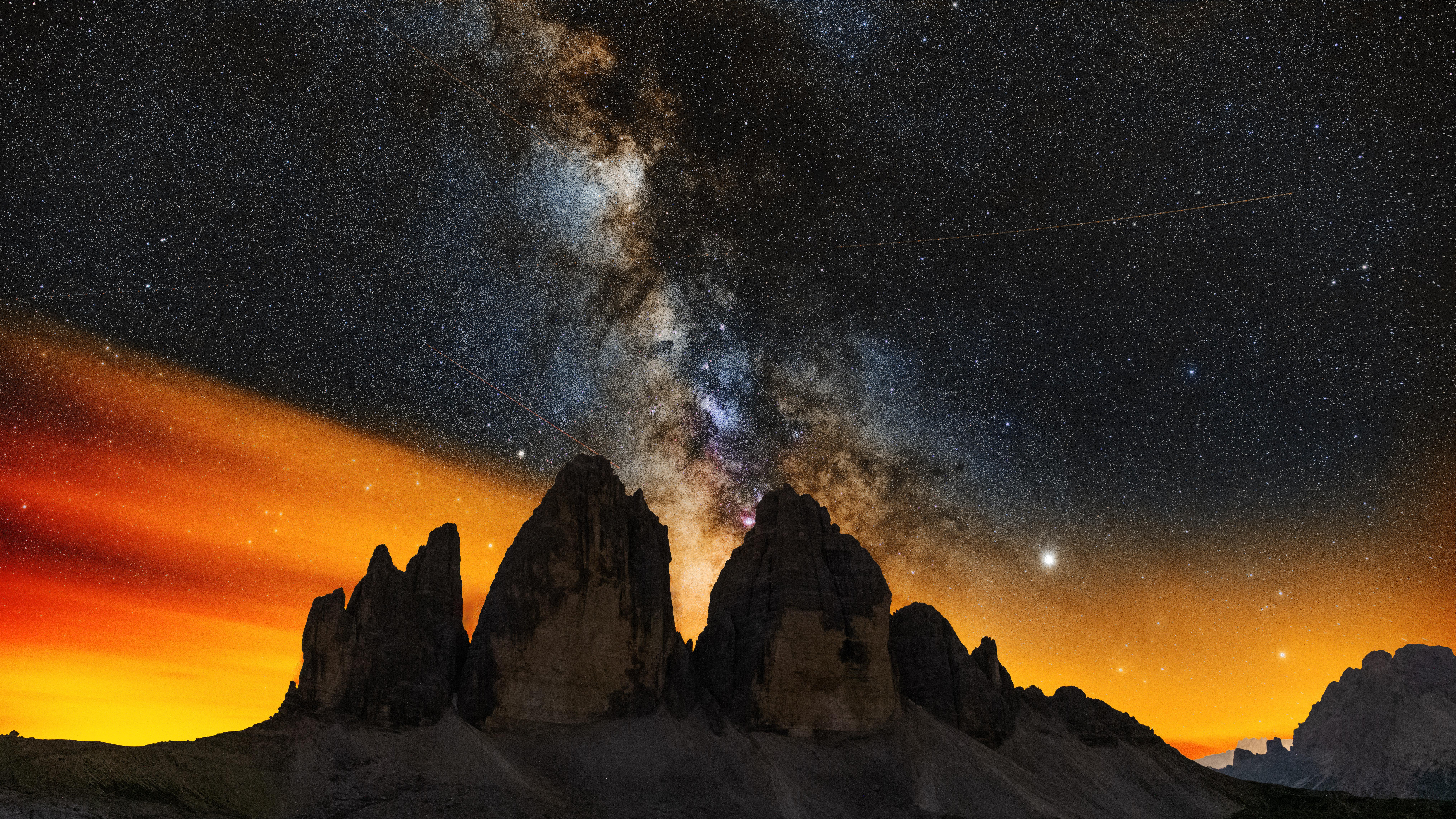 milky ways setting behind the tre cime di lavaredo 4k 1602533775