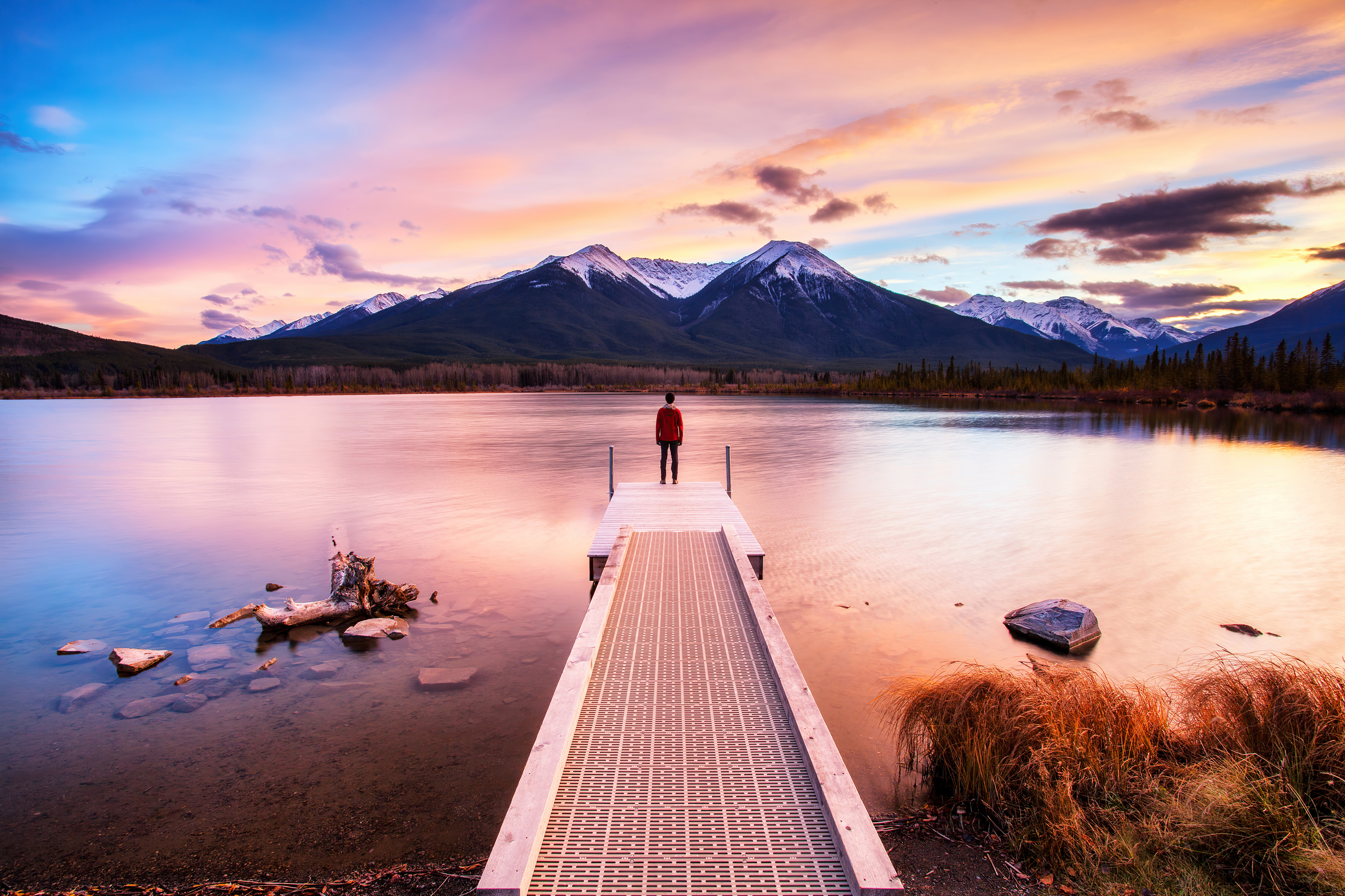 standing on dock sunset 4k 1602504510