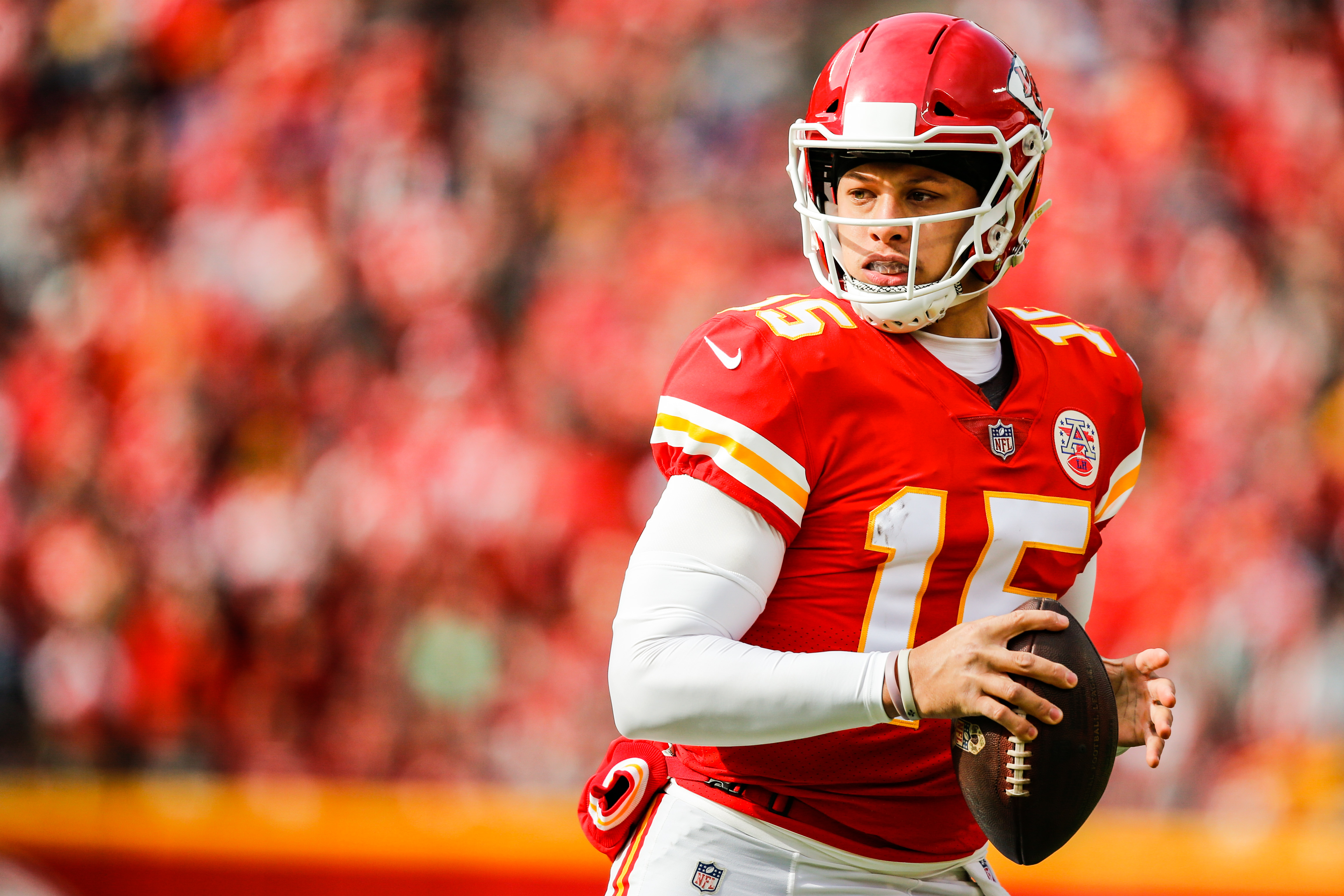 patrick mahomes is trying to throw a sprint football wearing red and white  sports dress and helmet in blur audience background hd sportsHD Wallpapers   HD Wallpapers  ID 42301