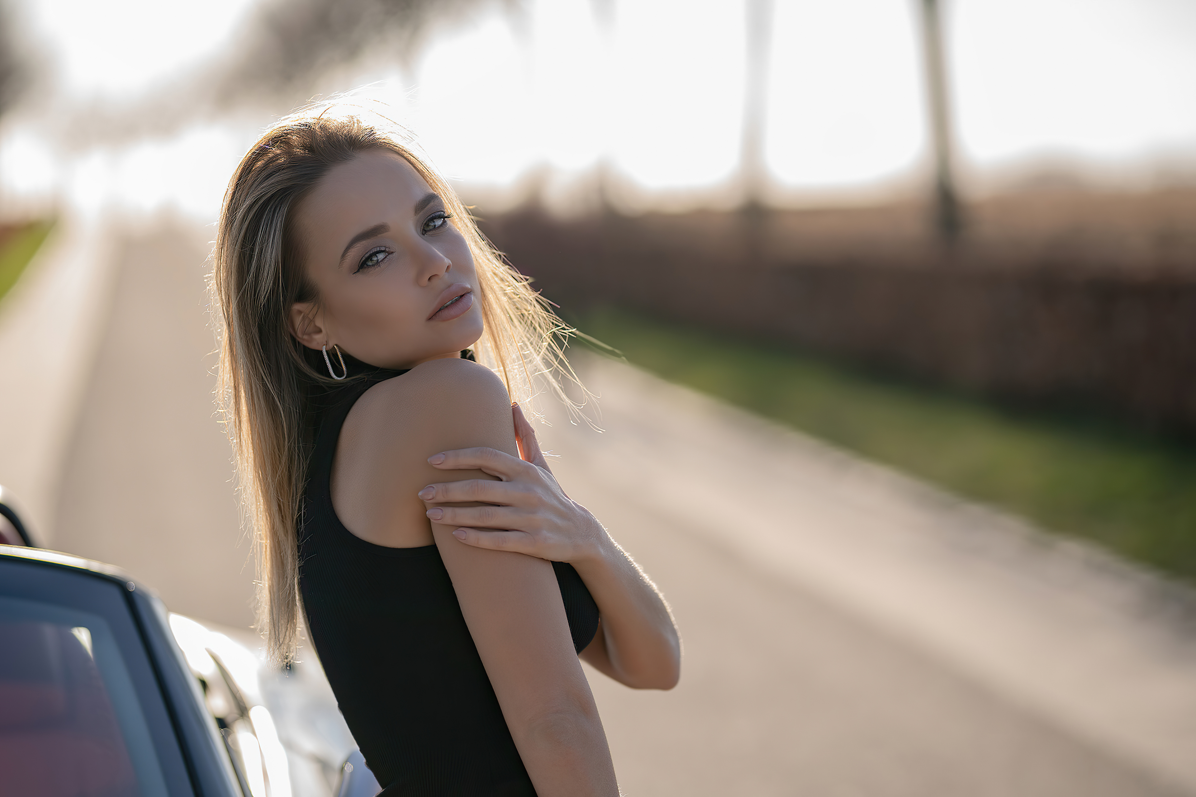 blonde girl looking back car outdoor 4k 1629254134