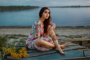 girl lake side sitting on fisher boat 4k 1629242736