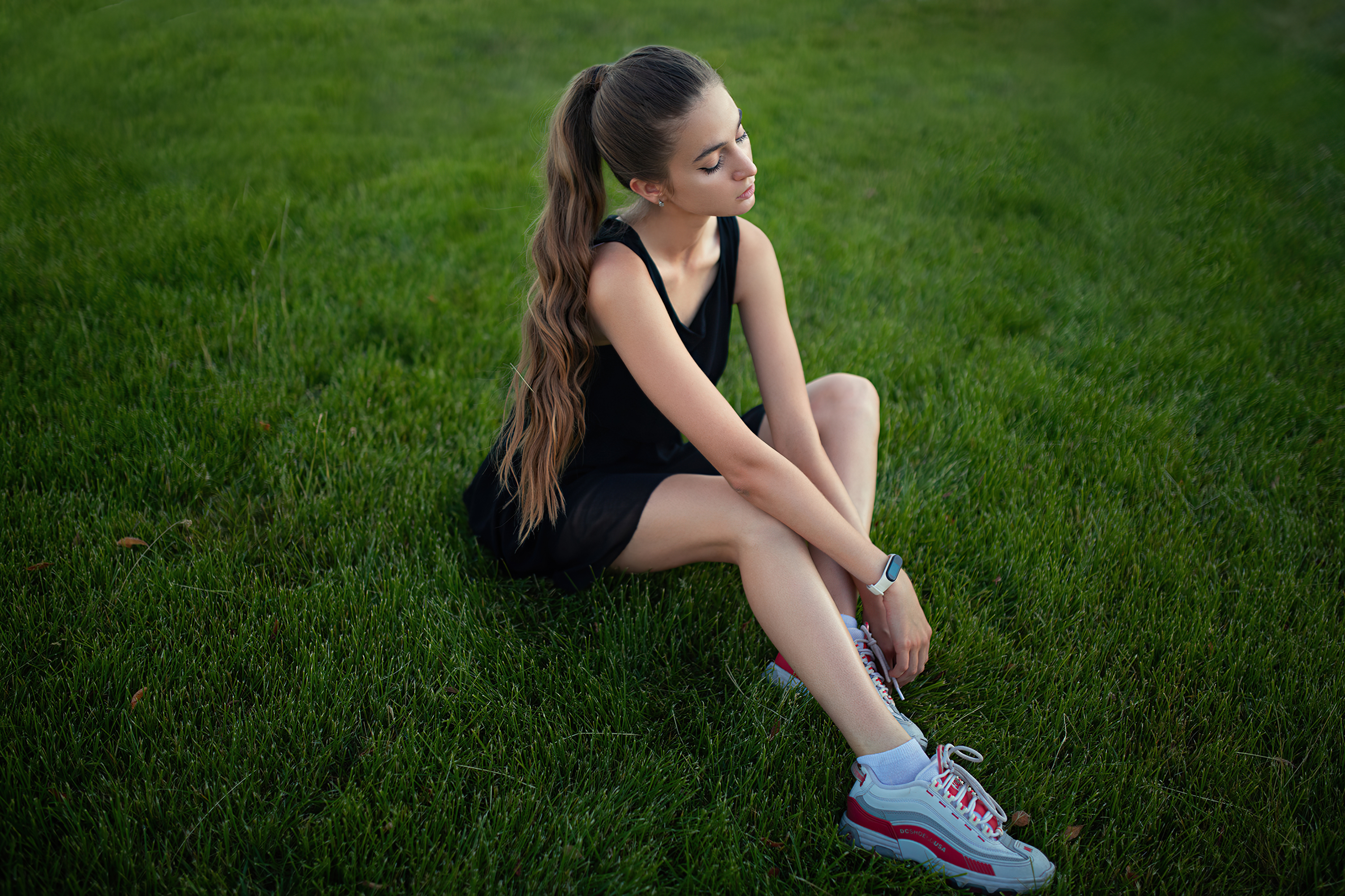 girl model sitting on grass long hair 4k 1629252184