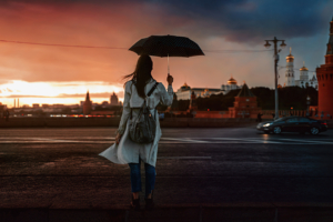 girl with umbrella crossing street 4k 1629237321