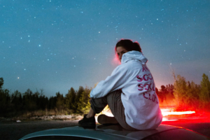 women sitting on top of car 4k 1629240324