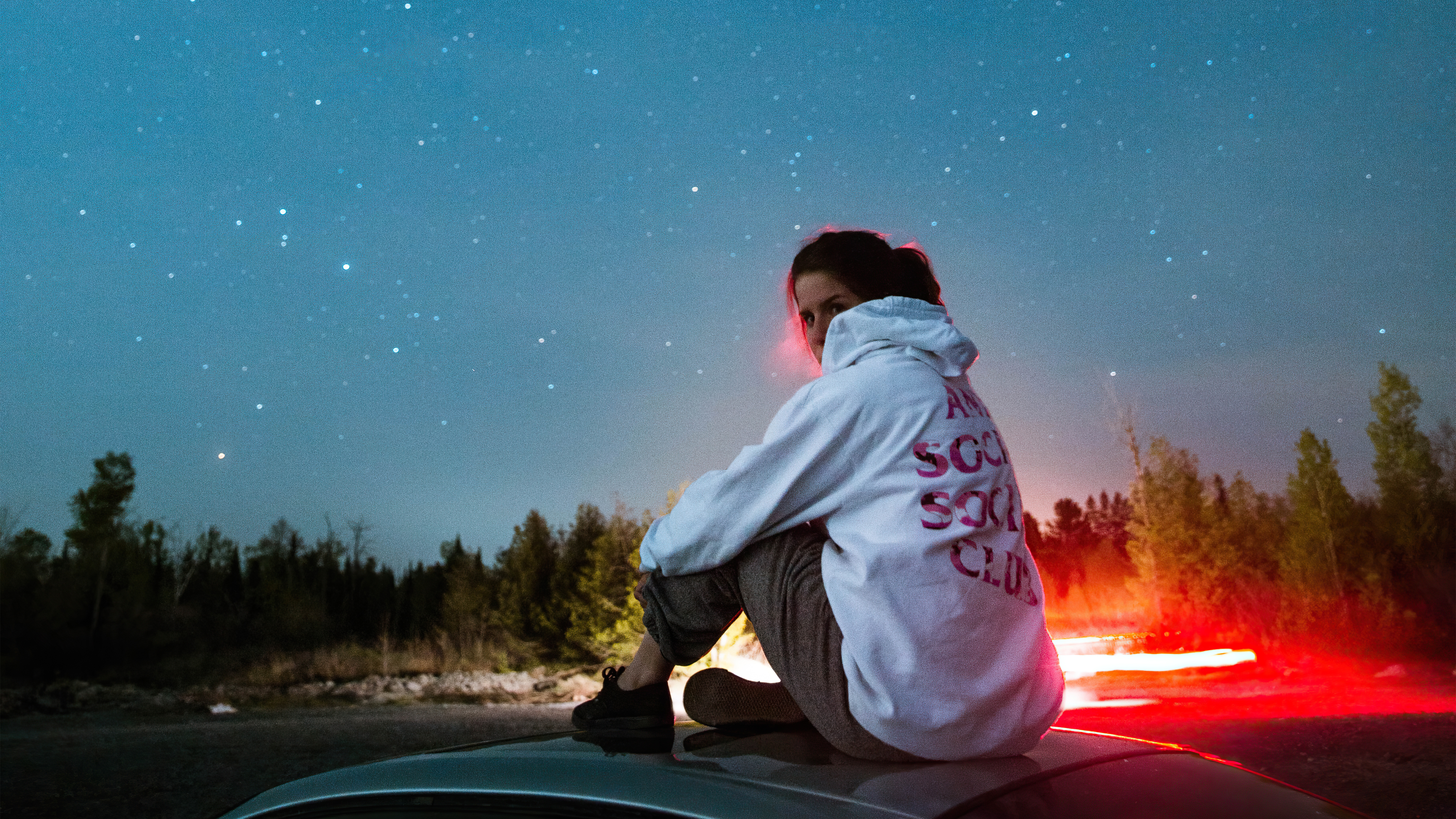 women sitting on top of car 4k 1629240324