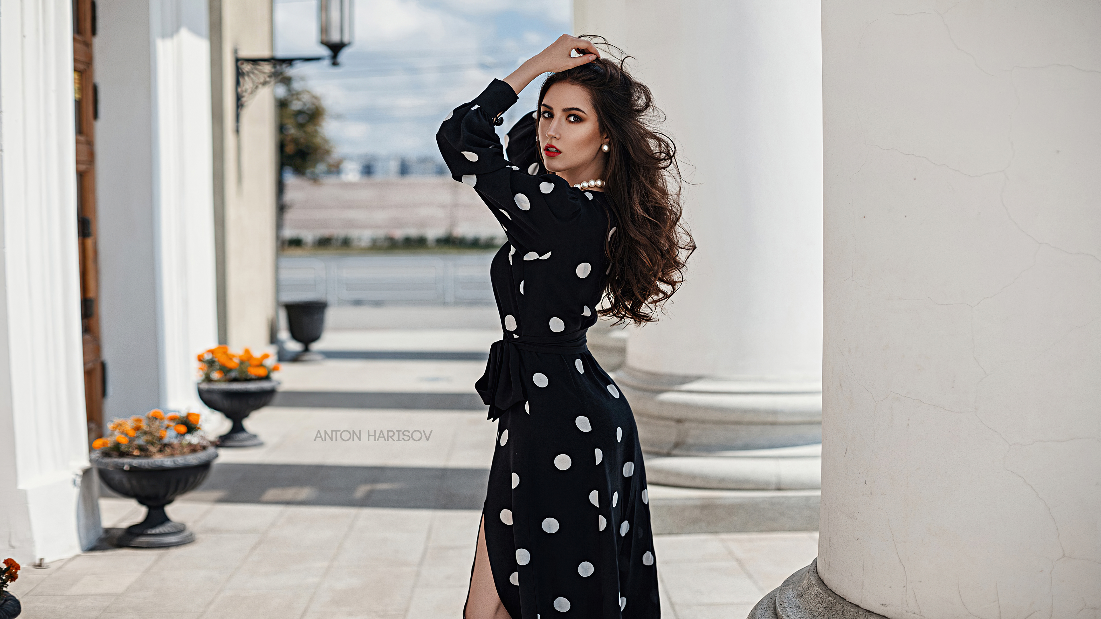 hands in hair looking back polka dot black dress 4k 1639250184