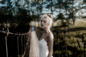 white dress girl on bridge pass 4k 1642252084