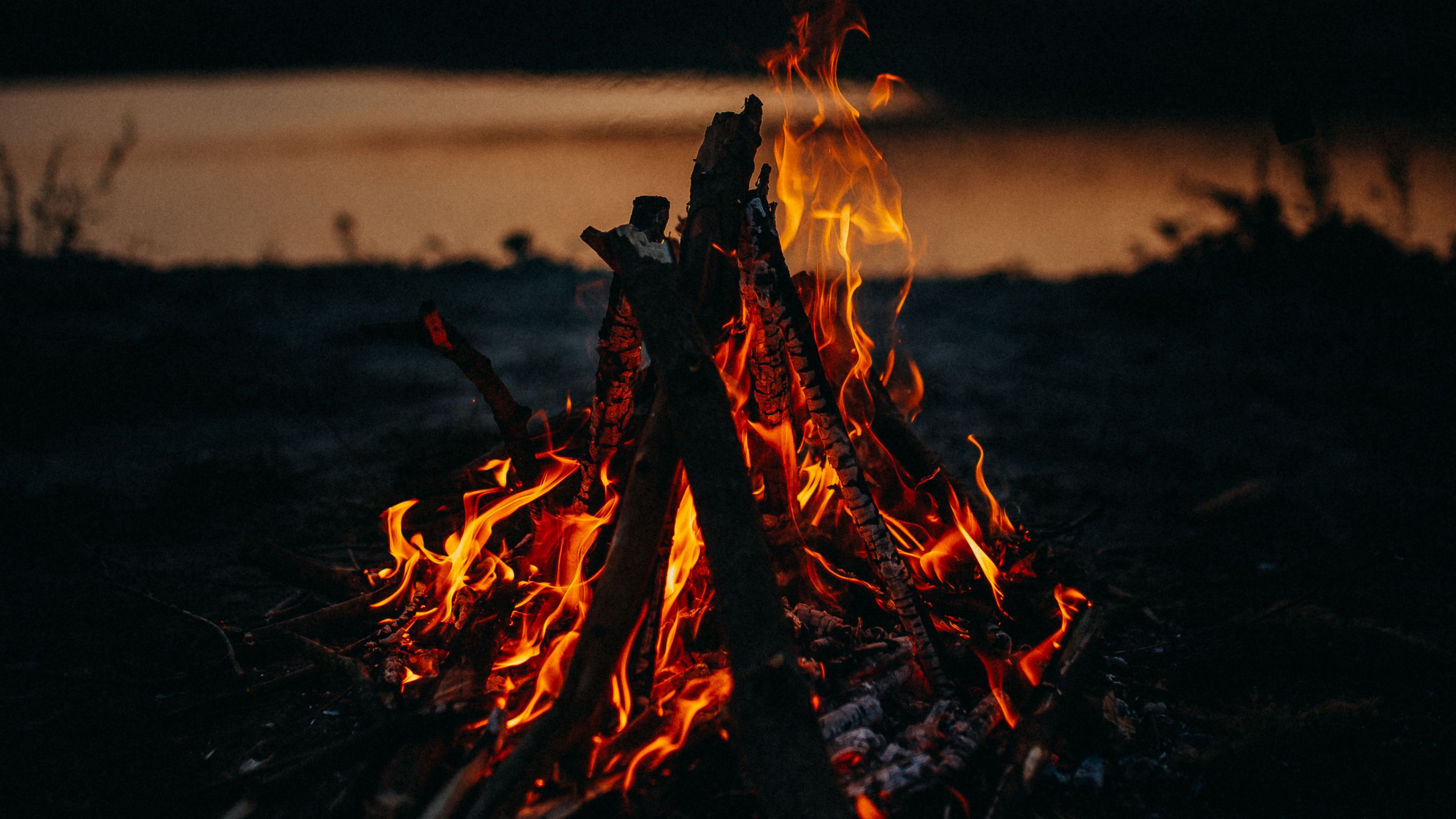 bonfire fire flame dark dusk 4k 1691839438