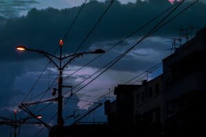 cable poles lights city twilight dark 4k 1691849539