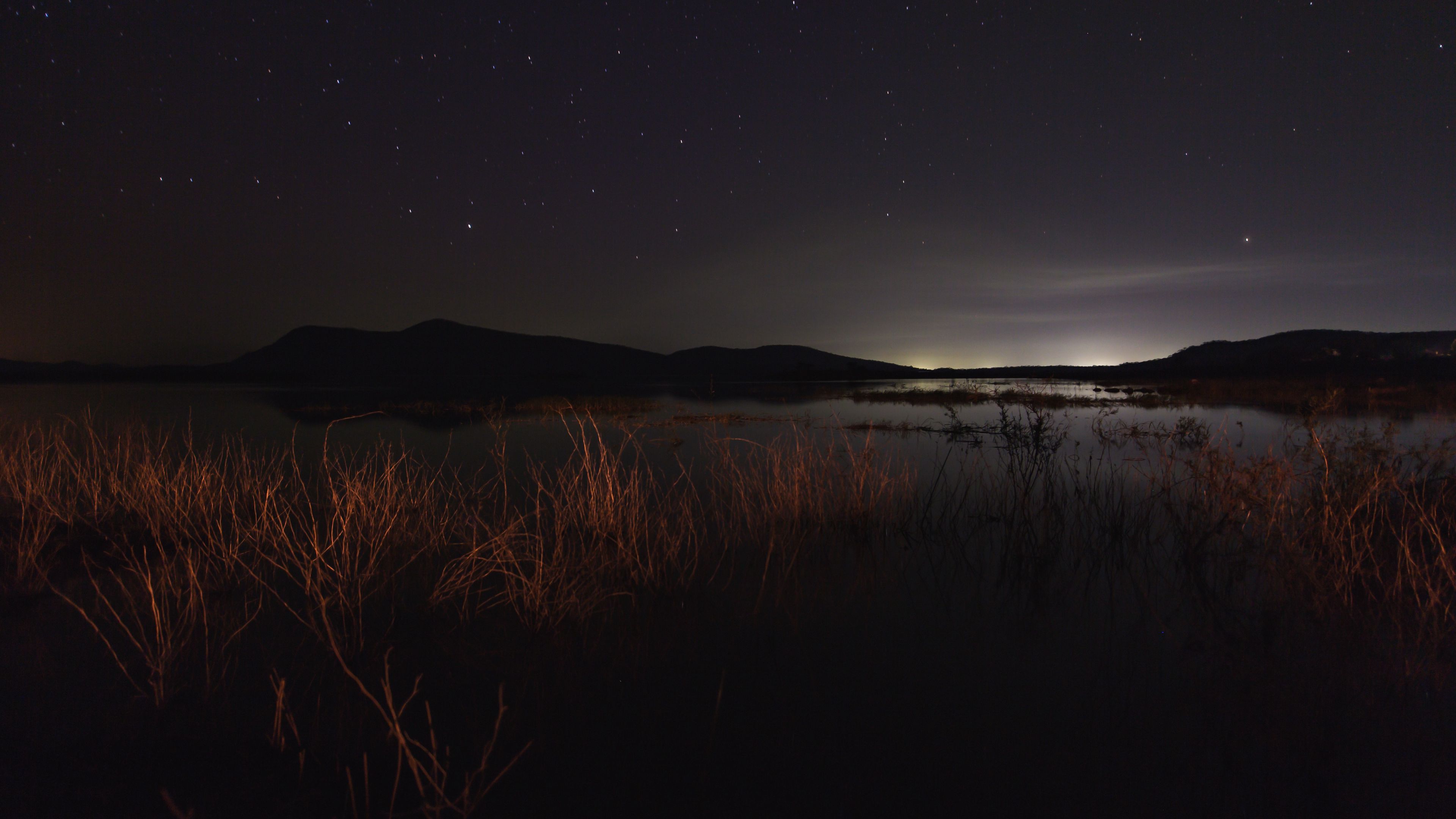 lake night starry sky grass darkness 4k 1692006755