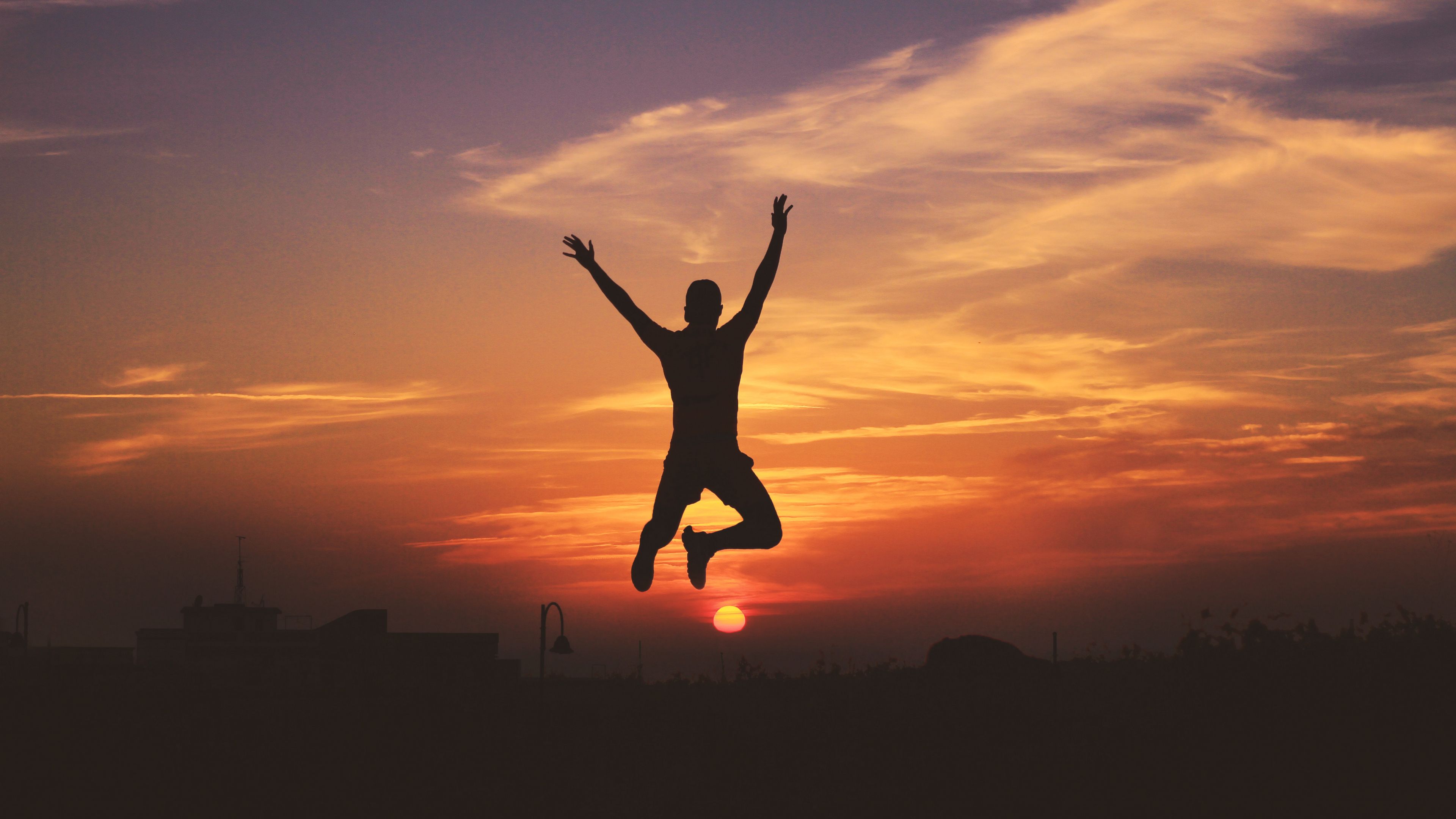 man silhouette jump sky sunset 4k 1692006750