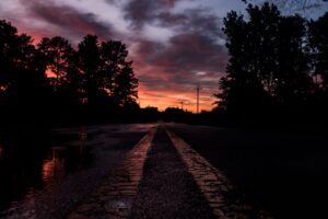 road sunset marking trees 4k 1691849809