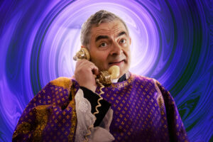 rowan atkinson is priest in wonka movie al.jpg